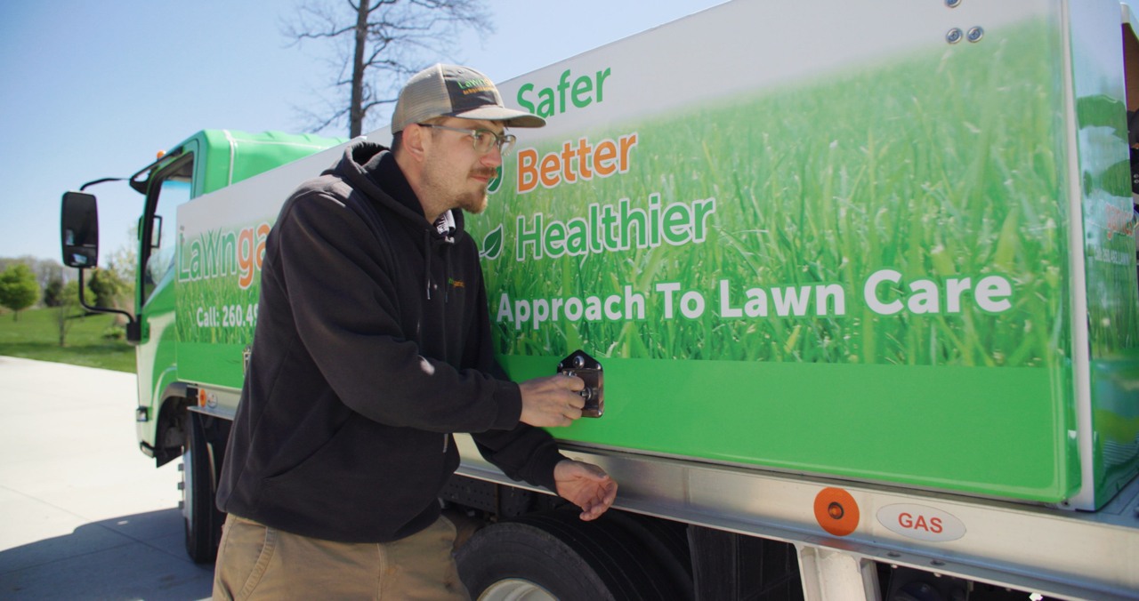 Lawnganics team member at truck on-site Lawnganics team member at truck on-site